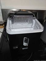Front and side view of Ultima Cosa ice maker on countertop