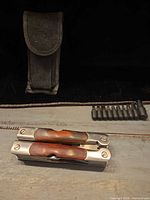 Multitool folded, bit holder, nylon sheath visible