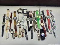 All 27 watches laid out showing full assortment