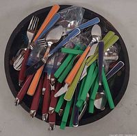 Flatware piled on top of tray