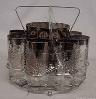 Front angle of full set showing eight glasses, ice bucket, carrier