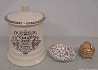 Group shot of biscuit jar, floral dish and trinket box