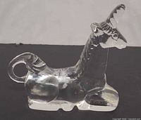 Side view showing full unicorn profile and Kosta Boda label