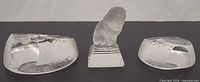 Front view of three frosted glass animal paperweights