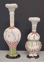 Both porcelain decanters front view