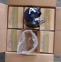 Shipping carton holding eleven boxed radios and one unboxed radio