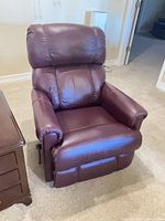 Front view of burgundy leather La-Z-Boy rocking recliner chair