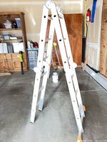 Aluminum articulating ladder set in A-frame position