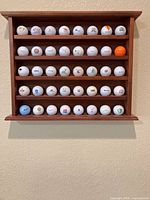 Wall-mount wooden rack with 40 logo golf balls