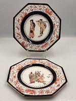 Front view of both hand painted octagonal plates showing decoration and shape