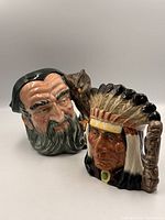 Front view of both character jugs side by side