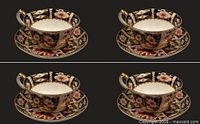 Overall view of four identical Imari 2451 cup and saucer sets