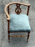 Top view of corner chair showing wood frame and blue upholstered seat