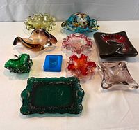 Group shot showing all 10 art glass ashtrays
