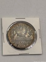 Reverse side of 1951 Canada silver dollar in holder