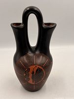 Front view showing butterfly motif and overall form