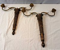 Pair of gilt two-arm wall sconces full view
