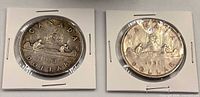 Front view of both 1951 and 1953 Canadian silver dollars in holders