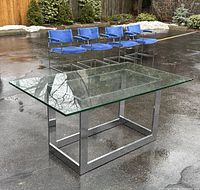 Full view of table with glass top and chrome base