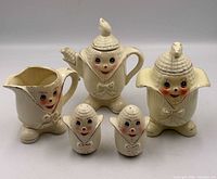 Full set showing teapot, sugar bowl, creamer, salt and pepper shakers