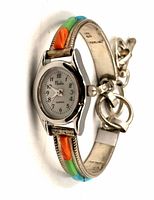 Front view of Nadia wristwatch showing dial and multicolour stone inlays