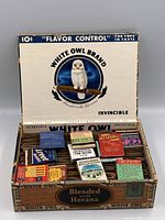 Open White Owl cigar box filled with vintage matchbooks