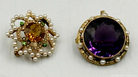 Front view of both brooches side by side
