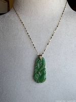 Necklace displayed on bust showing overall appearance and chain length