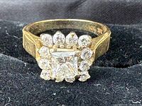 Top view showing princess-cut centre diamond and surrounding round diamonds