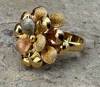 Front angle showing tri-colour gold petal flower cluster and shank