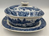 lidded butter dish seated on tray, showing overall design