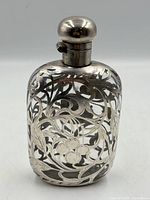 Front view showing silver overlay design and cap