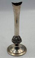Full view of sterling silver bud vase standing upright