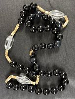 Full necklace laid flat showing bead pattern and clasp