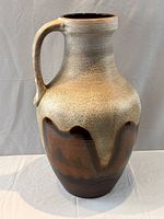 Front view of jug showing glaze pattern and handle