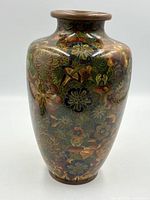 Front view showing overall millefleur cloisonné design and form