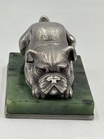 Front view of silver bulldog on jade base