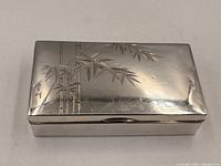 Top view showing bamboo engraving on lid of silver box