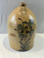 Front view showing cobalt floral design and merchant stamp