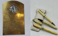 Brass WW1 French nursing plaque beside Waterman pen, pencil and thermometer
