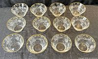 Twelve matching crystal bowls arranged 4×3