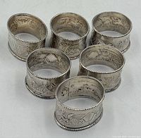 Group of six matching engraved sterling silver napkin rings