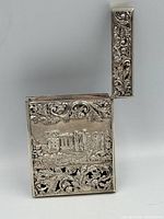 Card case front open showing lid and castle engraving
