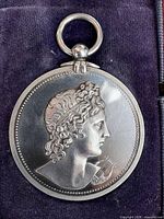 Obverse of silver medal featuring classical bust
