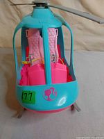 Front view of Barbie helicopter showing seats and logo
