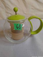 Full view of Bodum glass teapot with lid, handle and infuser