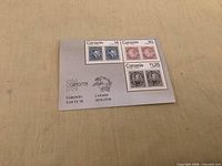 Front view of the souvenir sheet showing four stamps and printed selvage