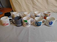 Group shot of ten assorted mugs front and back rows