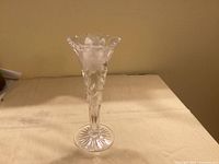 Full view of cut crystal vase standing upright