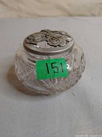 Round cut crystal jar with pewter rose-motif lid
